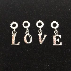 Silver-tone LOVE charm with pink stones